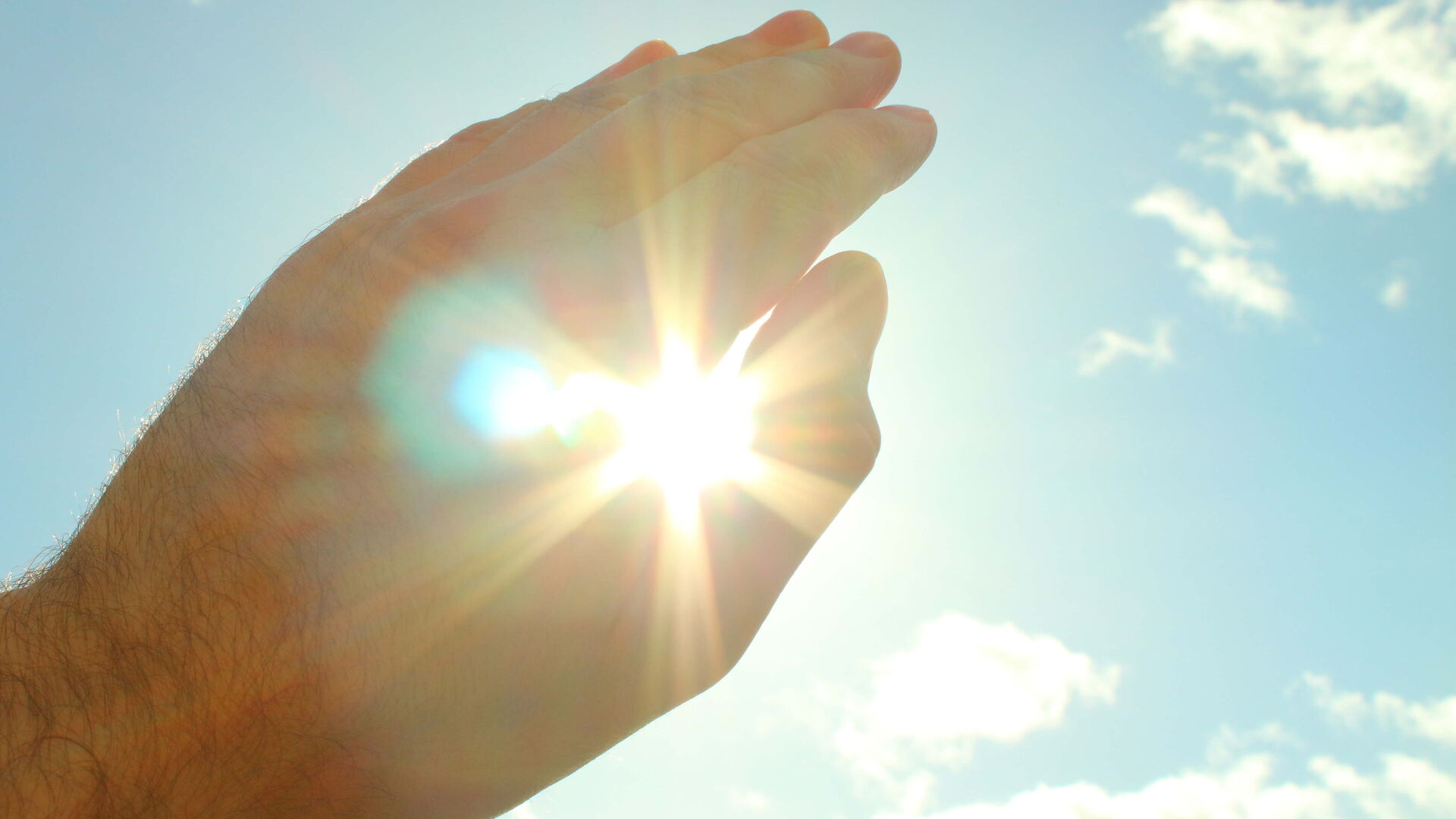Hand bedeckt Sonne